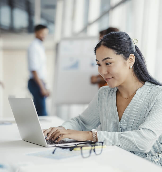 Woman using a laptop in an office