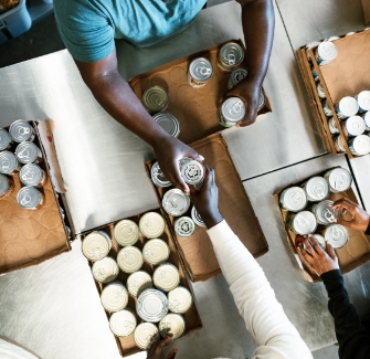 Distributing cans of food