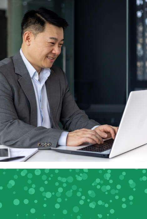 Man working on a laptop and green dot pattern collage